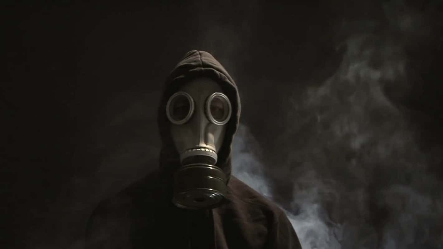 man-in-gas-mask-with-smoke-rising_qkslbauc__f0000-1526527539594.jpg