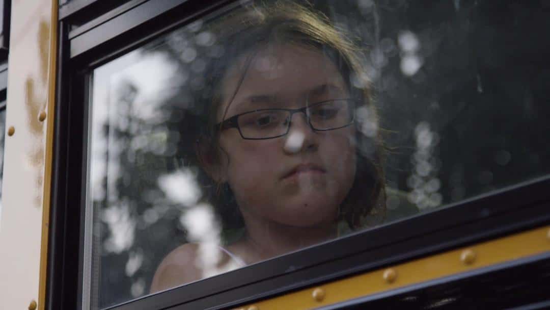 nerdy-girl-on-the-school-bus_n14nvtu3_thumbnail-full01-1533225474792.jpg