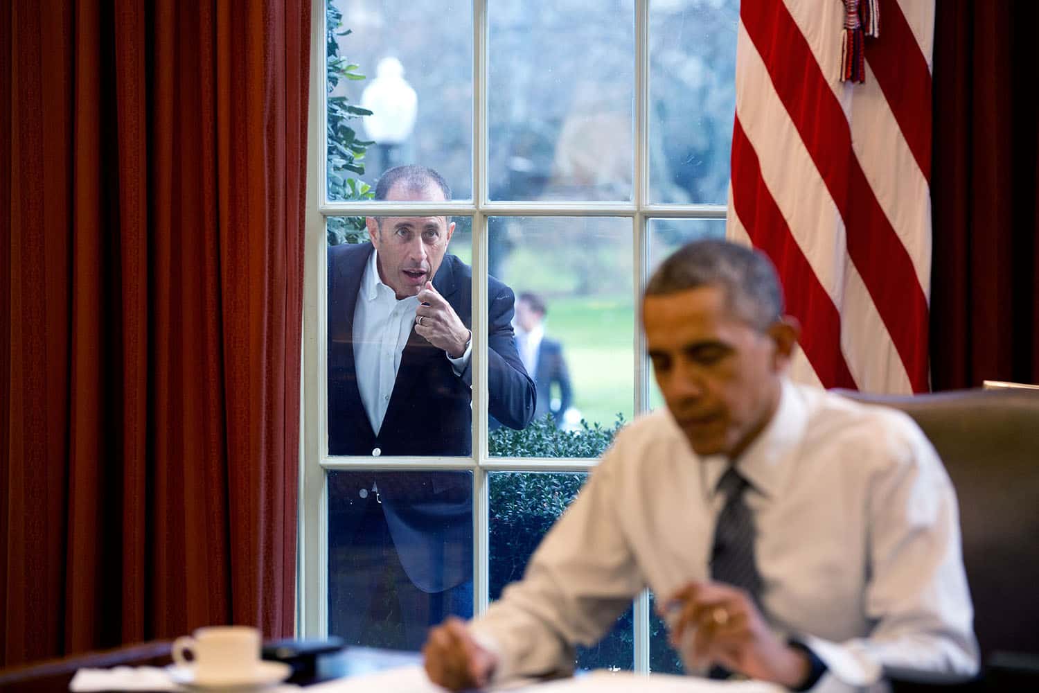 jerry_seinfeld_knocks_on_the_oval_office_window-1544042704766.jpg