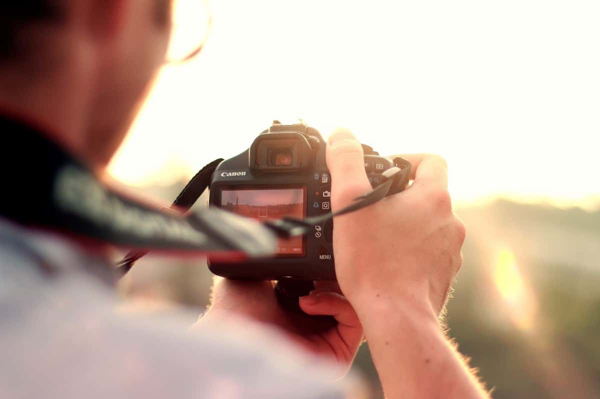 man-camera-taking-photo-photographer-1562673315235.jpg
