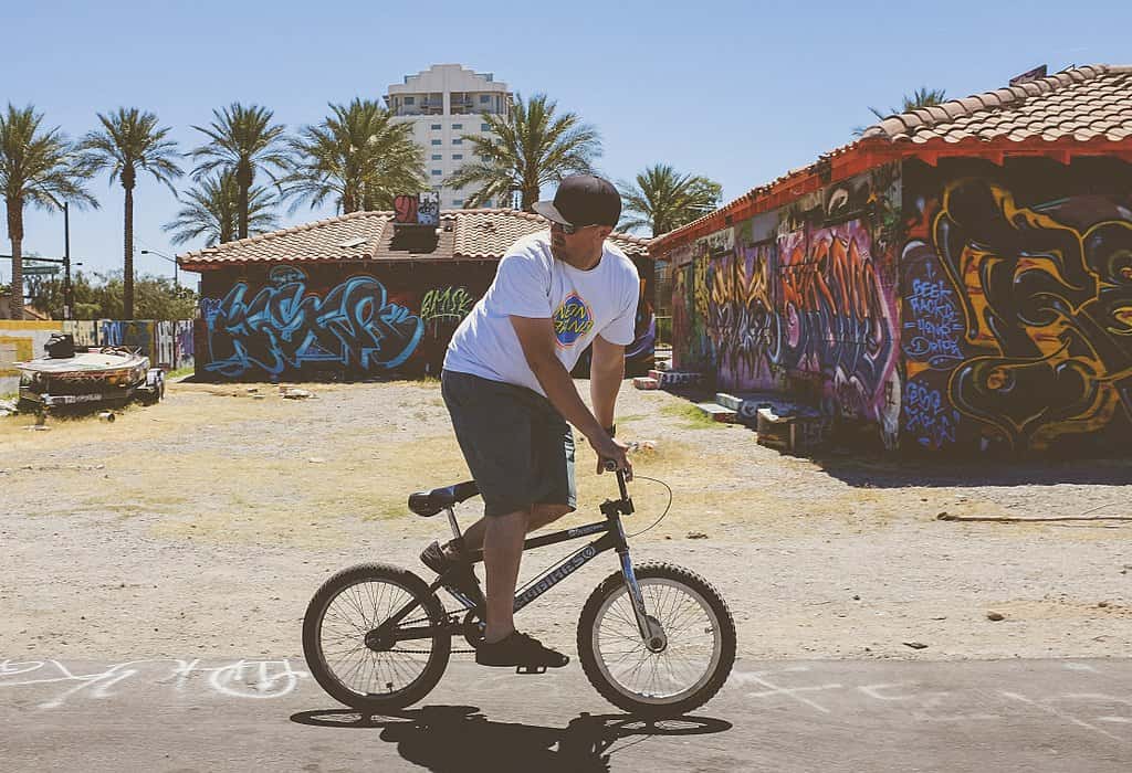 1024px-man_riding_bike_in_front_of_graffiti_-unsplash--1541485545809.jpg