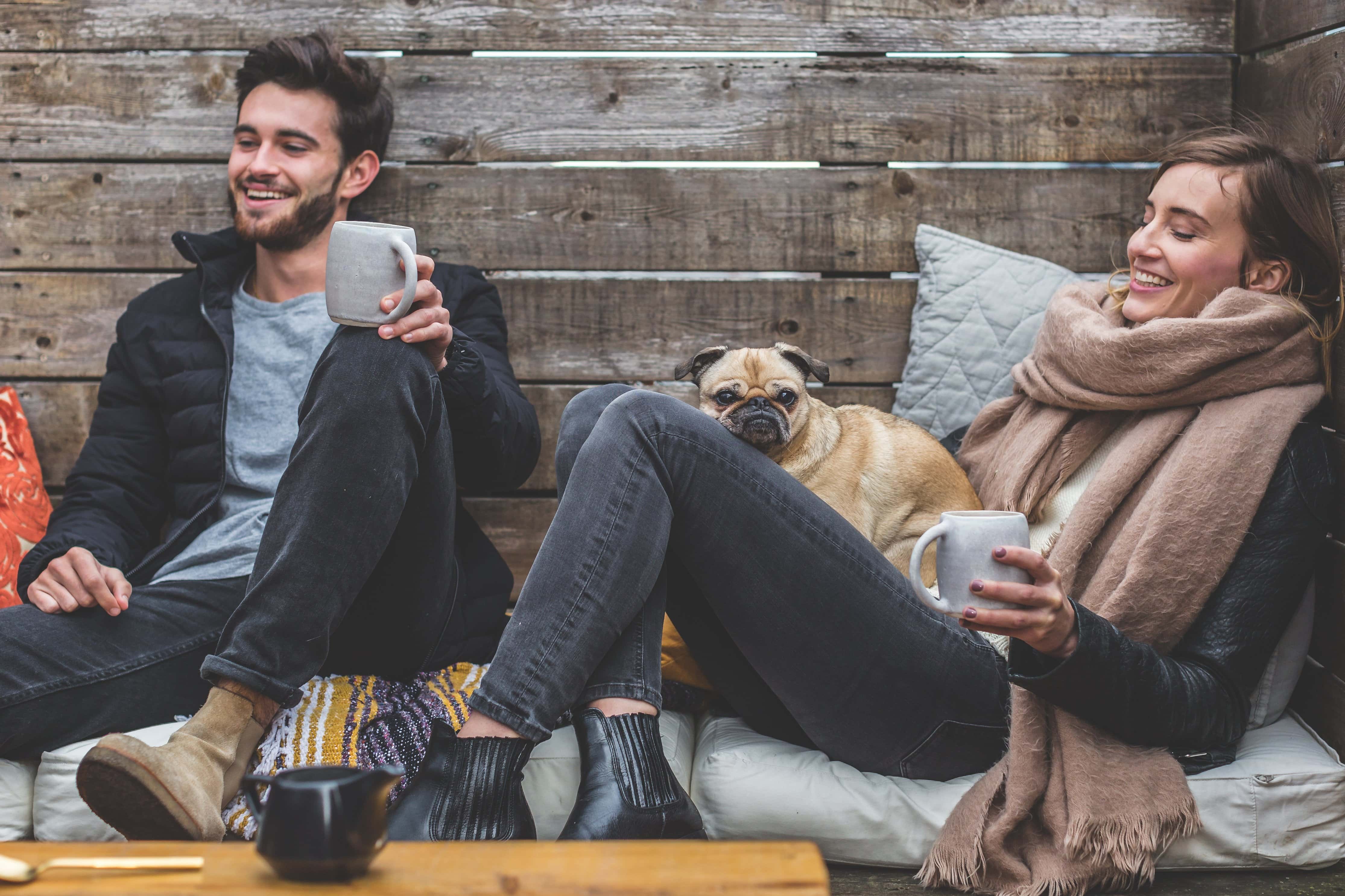 Canva - Couple Hanging Out with their Dog