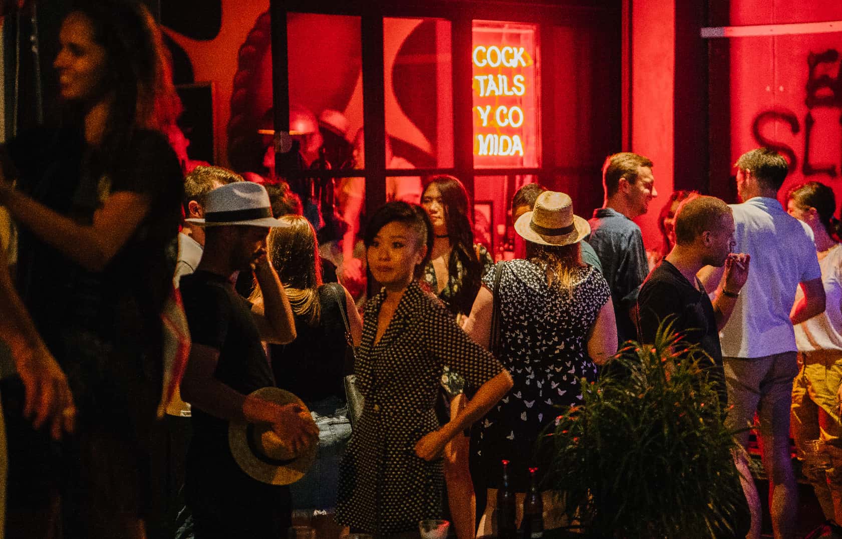 Canva - Group of People Standing Waiting Outside The Bar