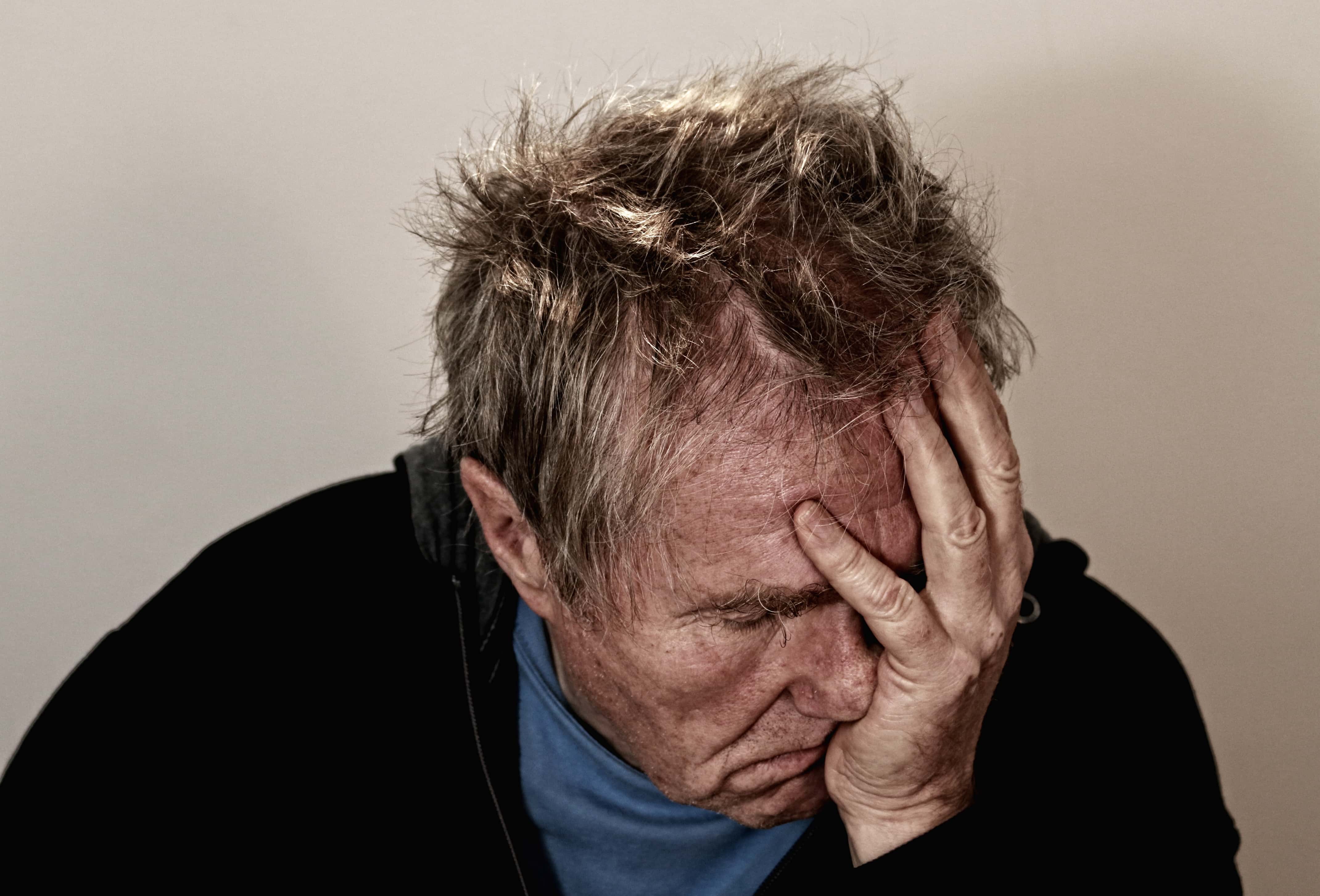 Canva - Man Holding His Face