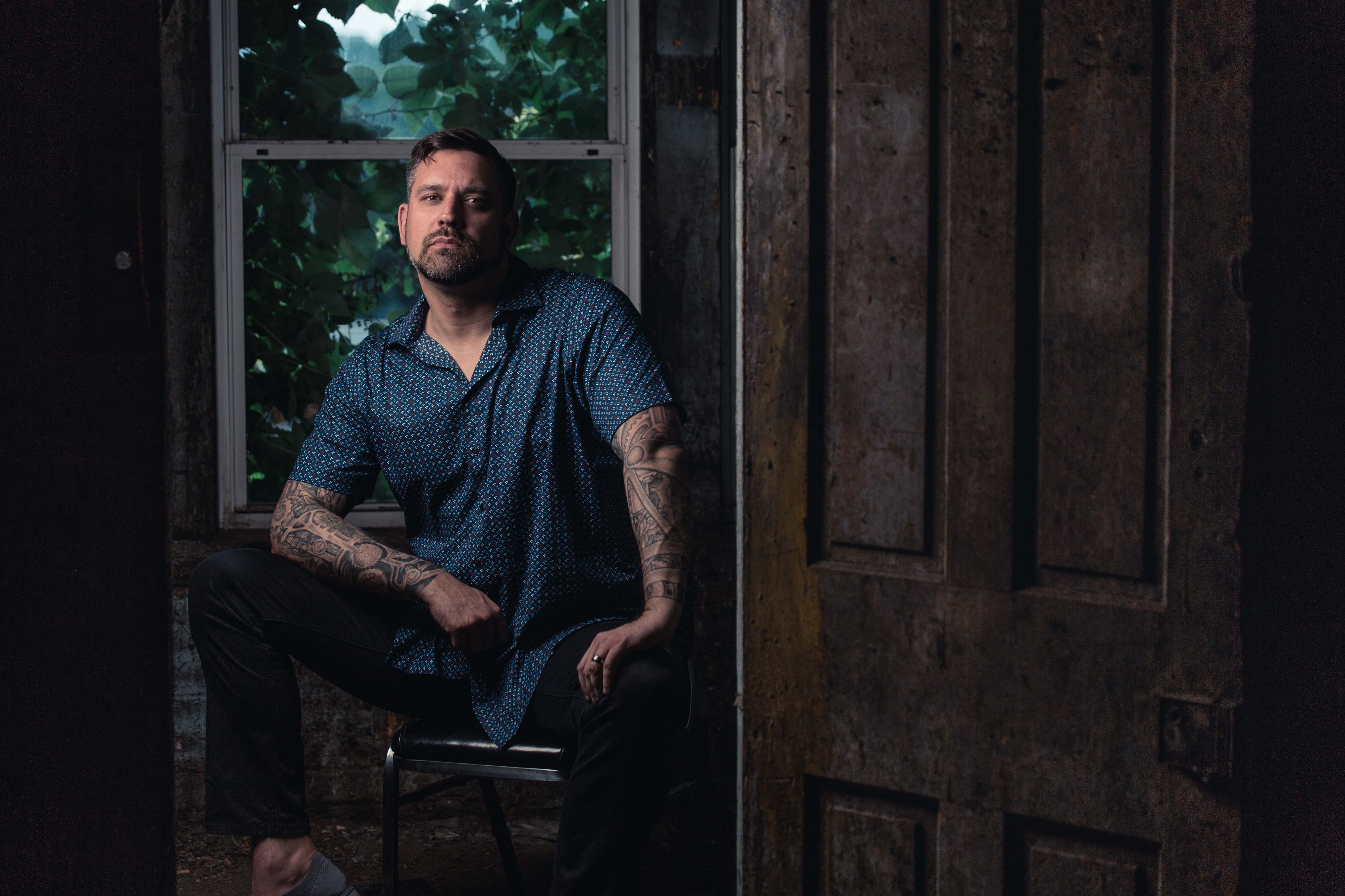 Canva - Man Sitting on Chair Near Clear Glass Window