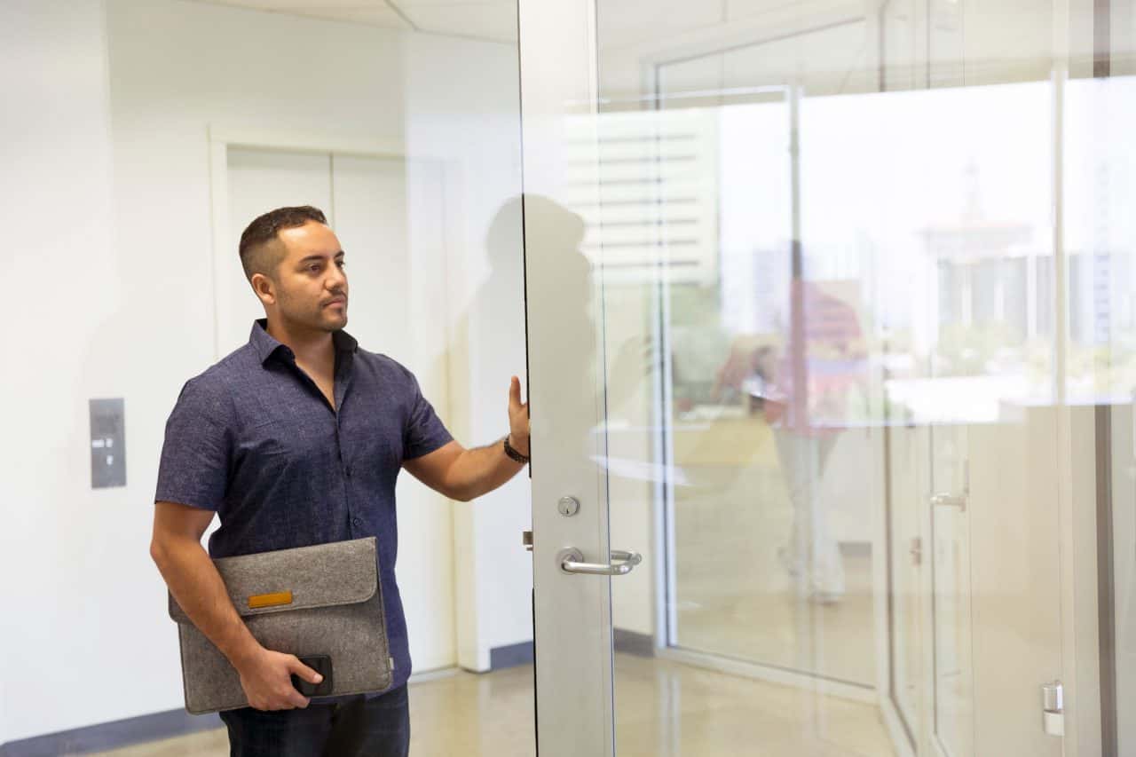 Canva - Man Standing Next to Glass Door
