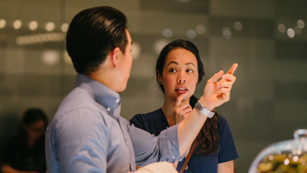 Canva - Man Standing in Front of Woman