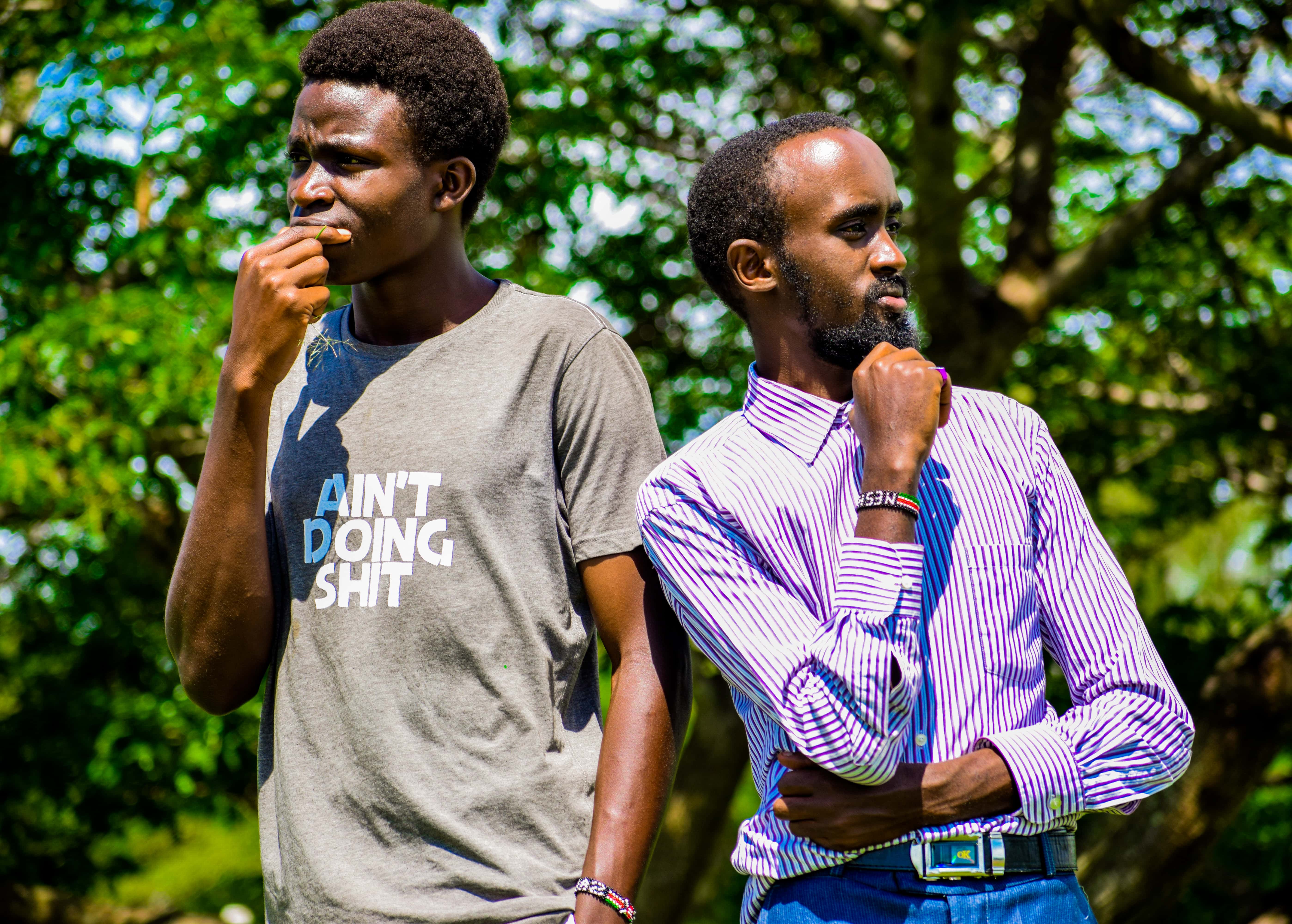 Canva - Man Wearing Purple Dress Shirt Standing Near Man in Gray Shirt