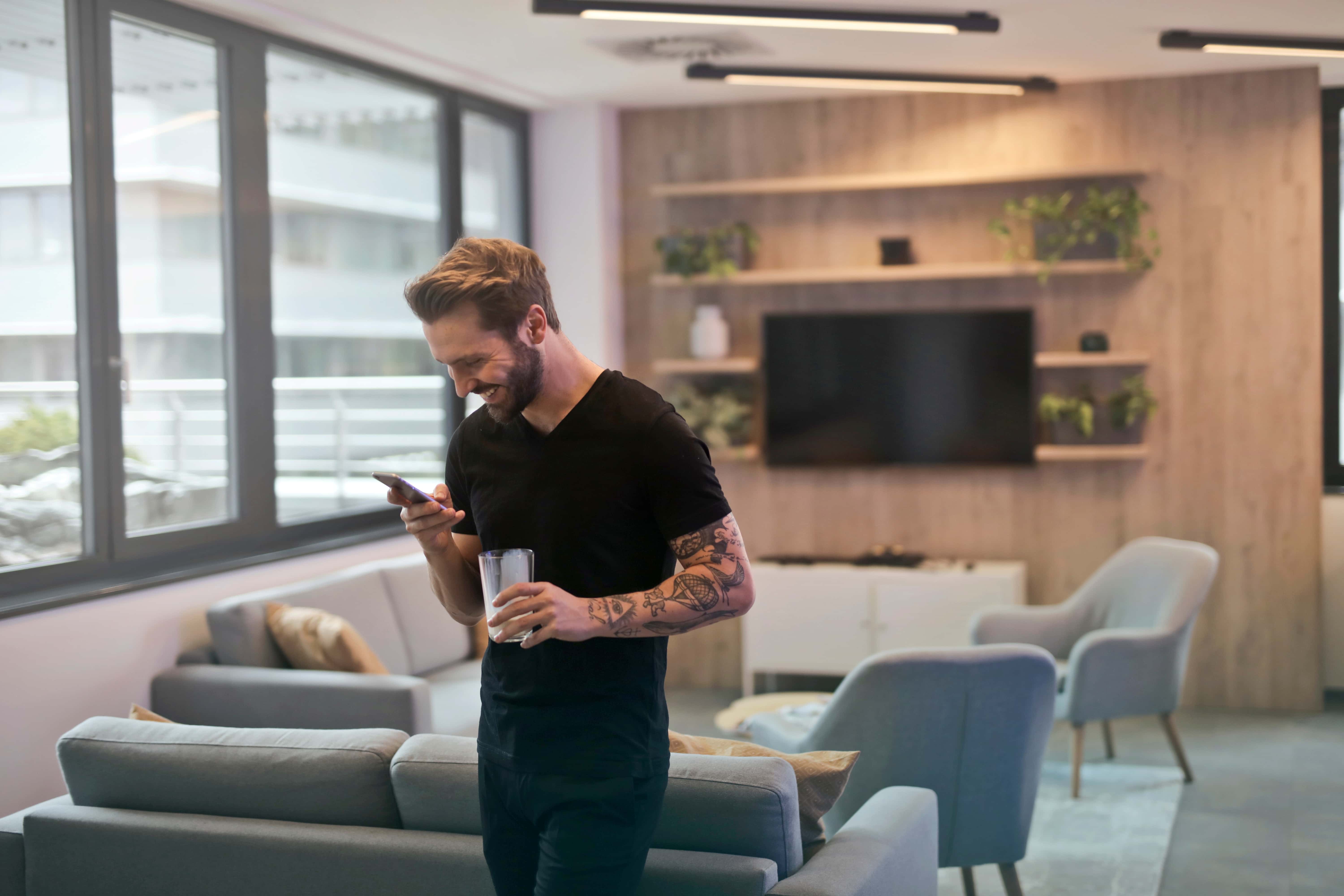 Canva - Man in Black Shirt Standing While Holding Drinking Glass