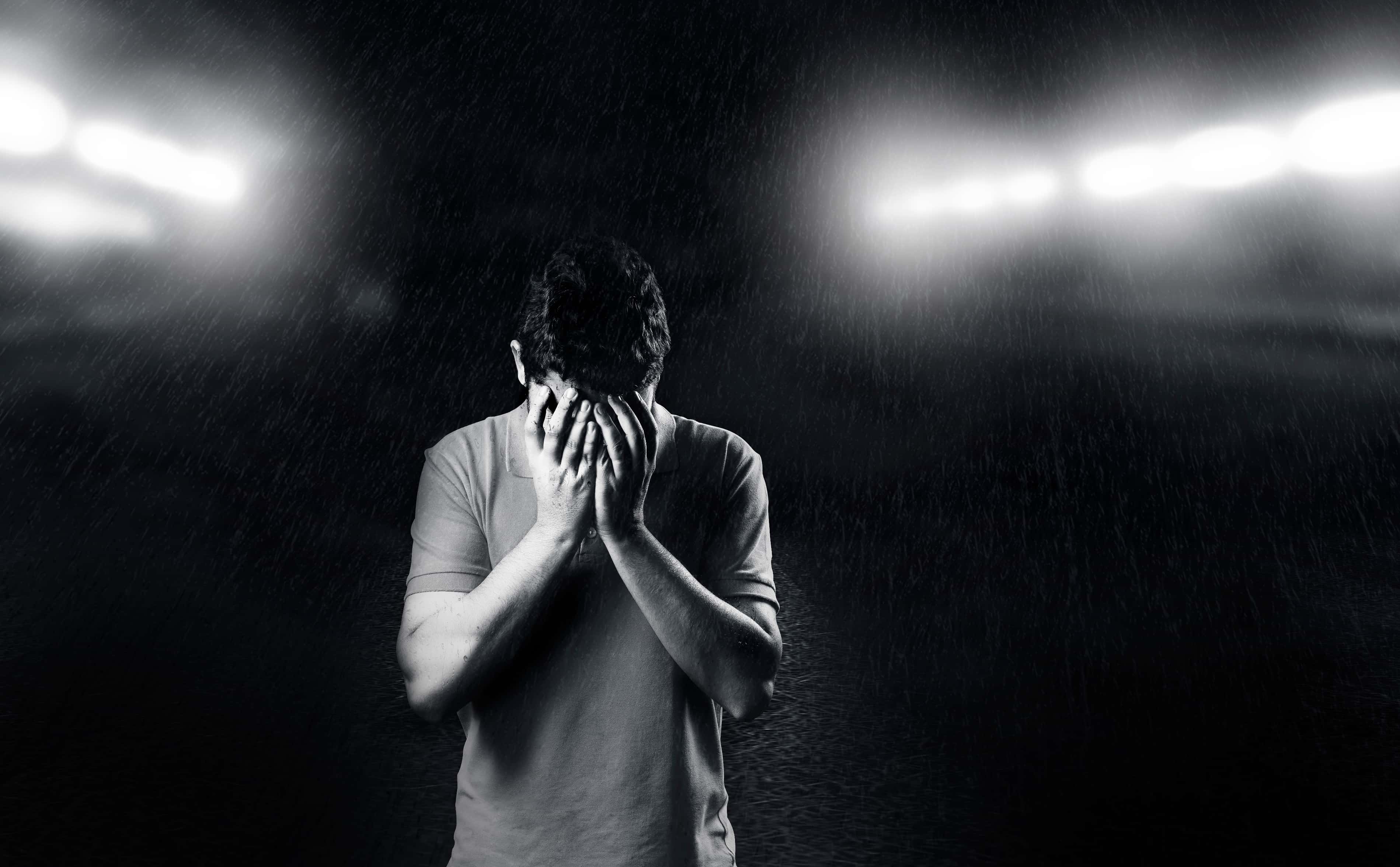 Canva - Monochrome Photo of Man Covering His Face