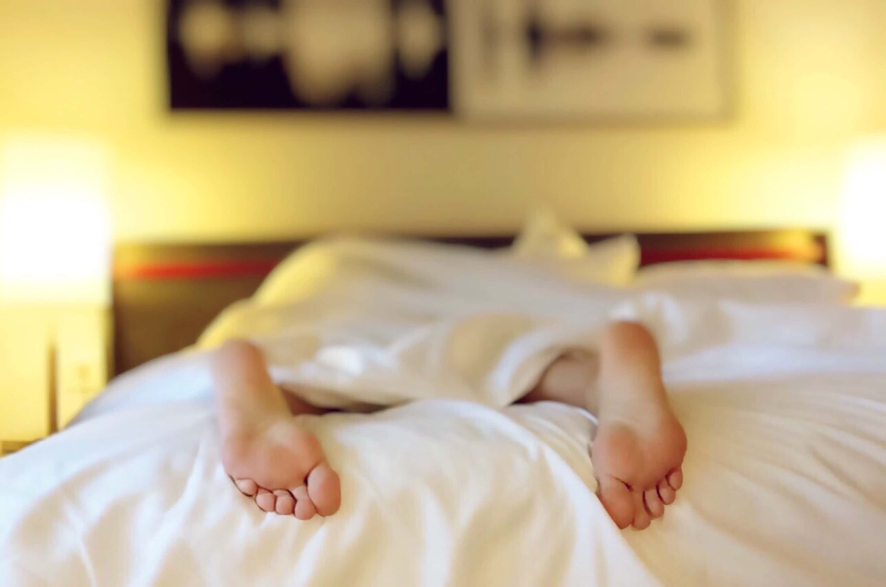 Canva - Person Lying on Bed Covering White Blanket