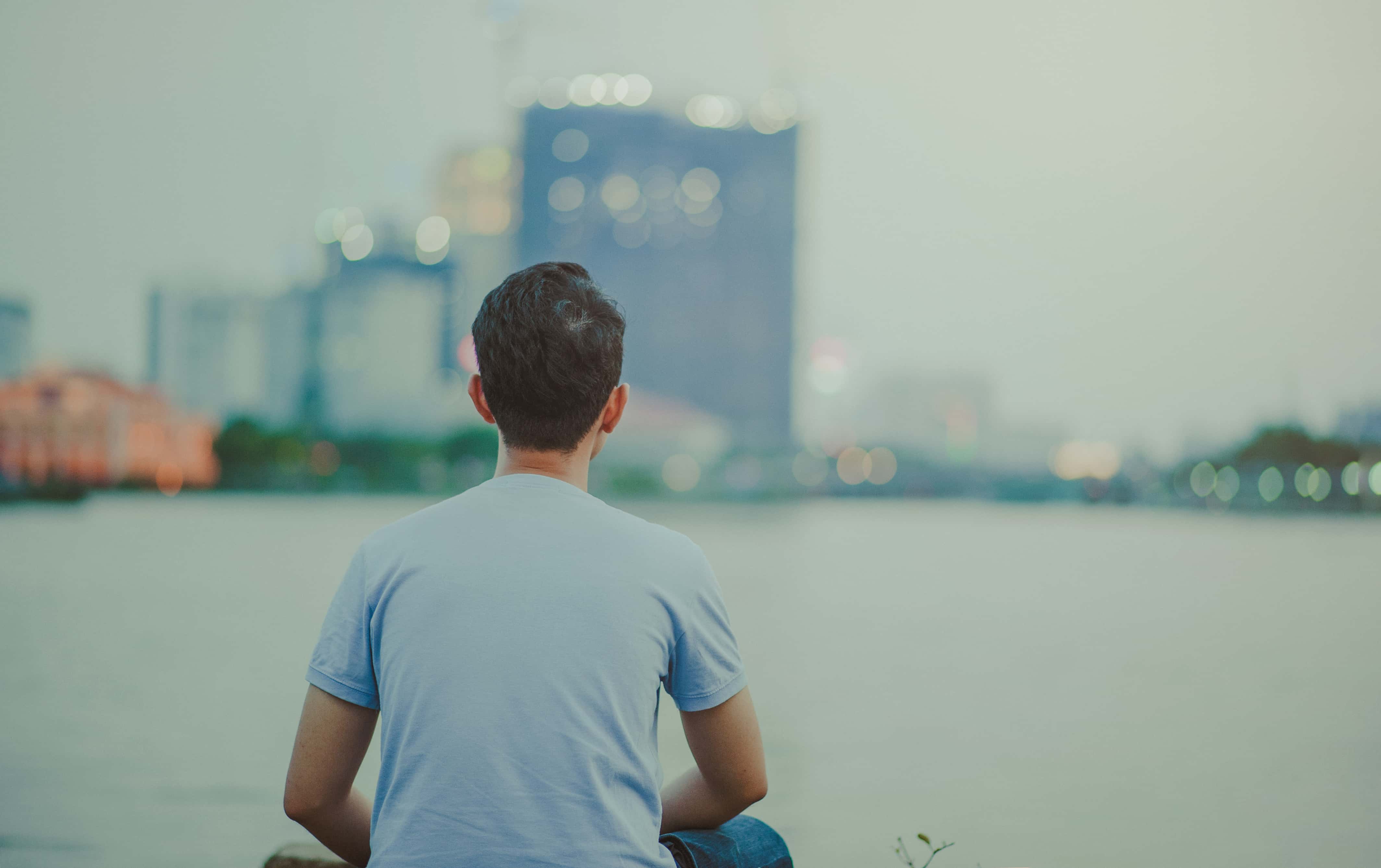 Canva - Photo of Man Wearing Blue Shirt Sitting Looking on High-rise Buildings