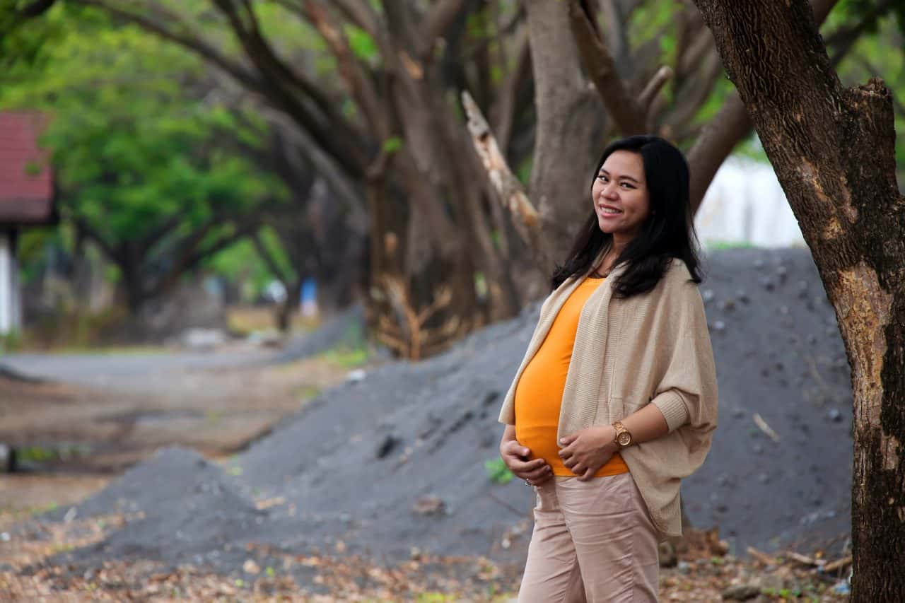 Canva - Photo of Pregnant Woman Standing Near Tree