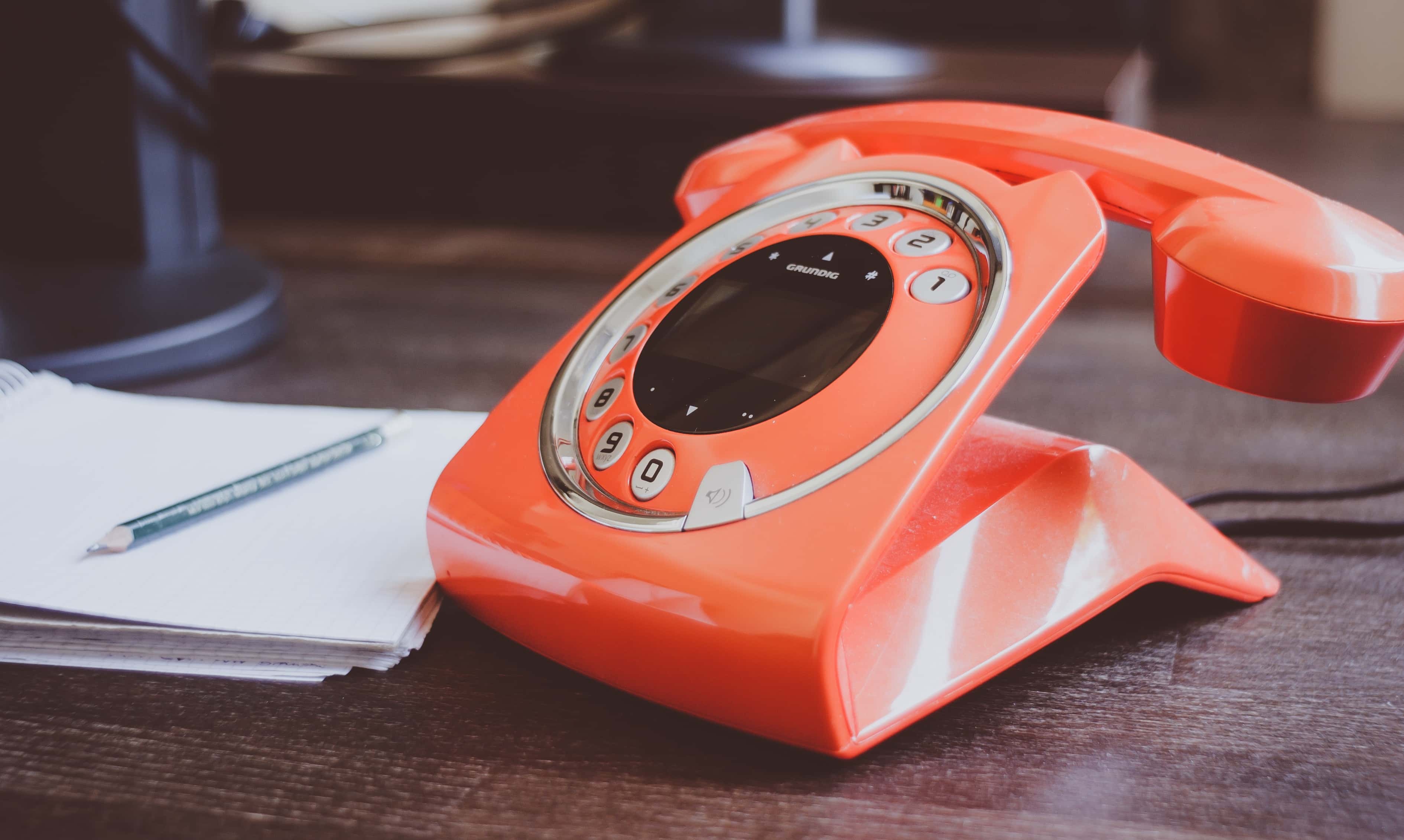 Canva - Red Cradle Telephone on Brown Wooden Surface