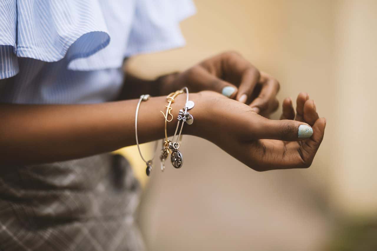 Canva - Selective Focus Photography of Person Wearing Three Bangles