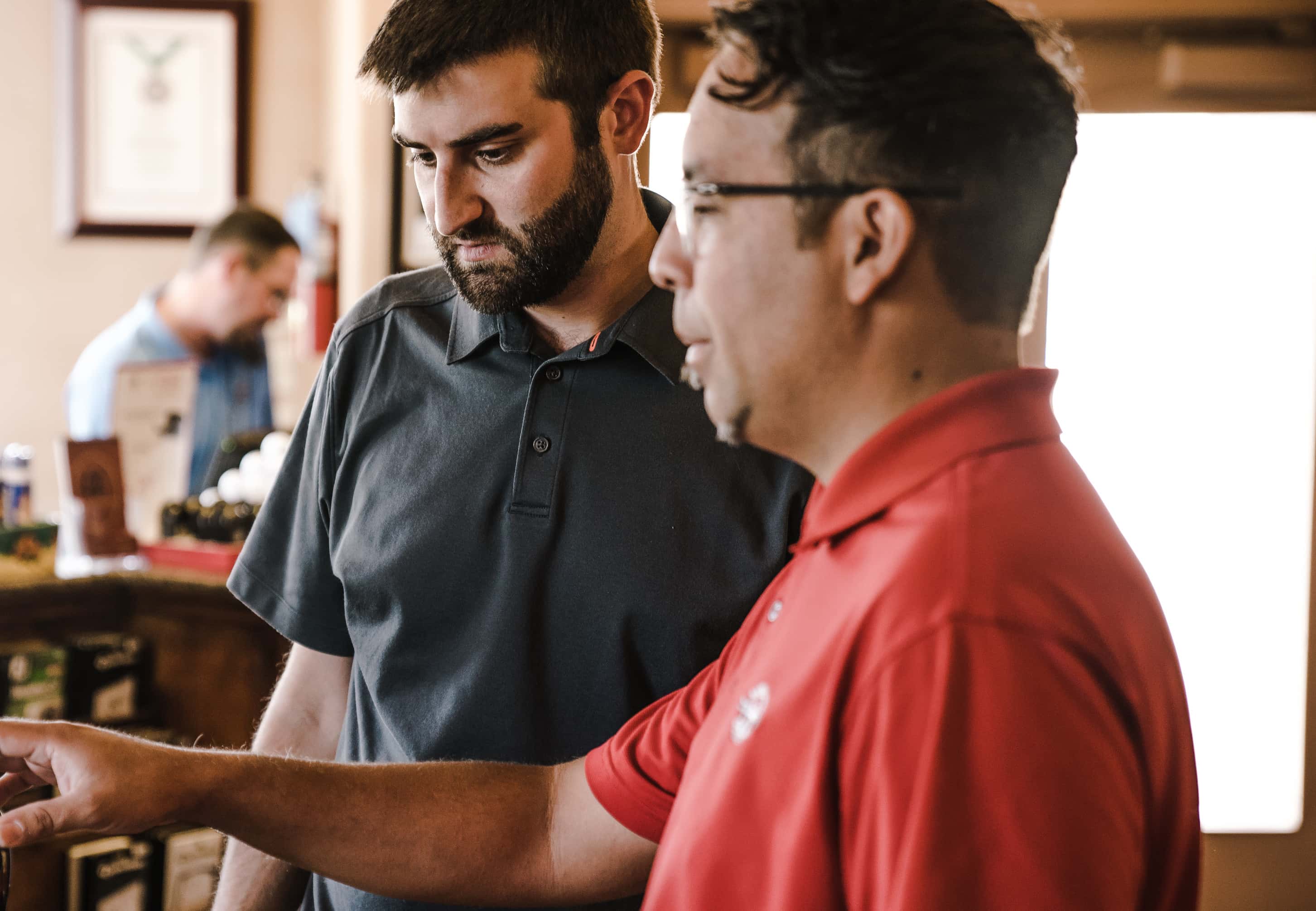 Canva - Two Man Standing Near Golf Clubs(1)