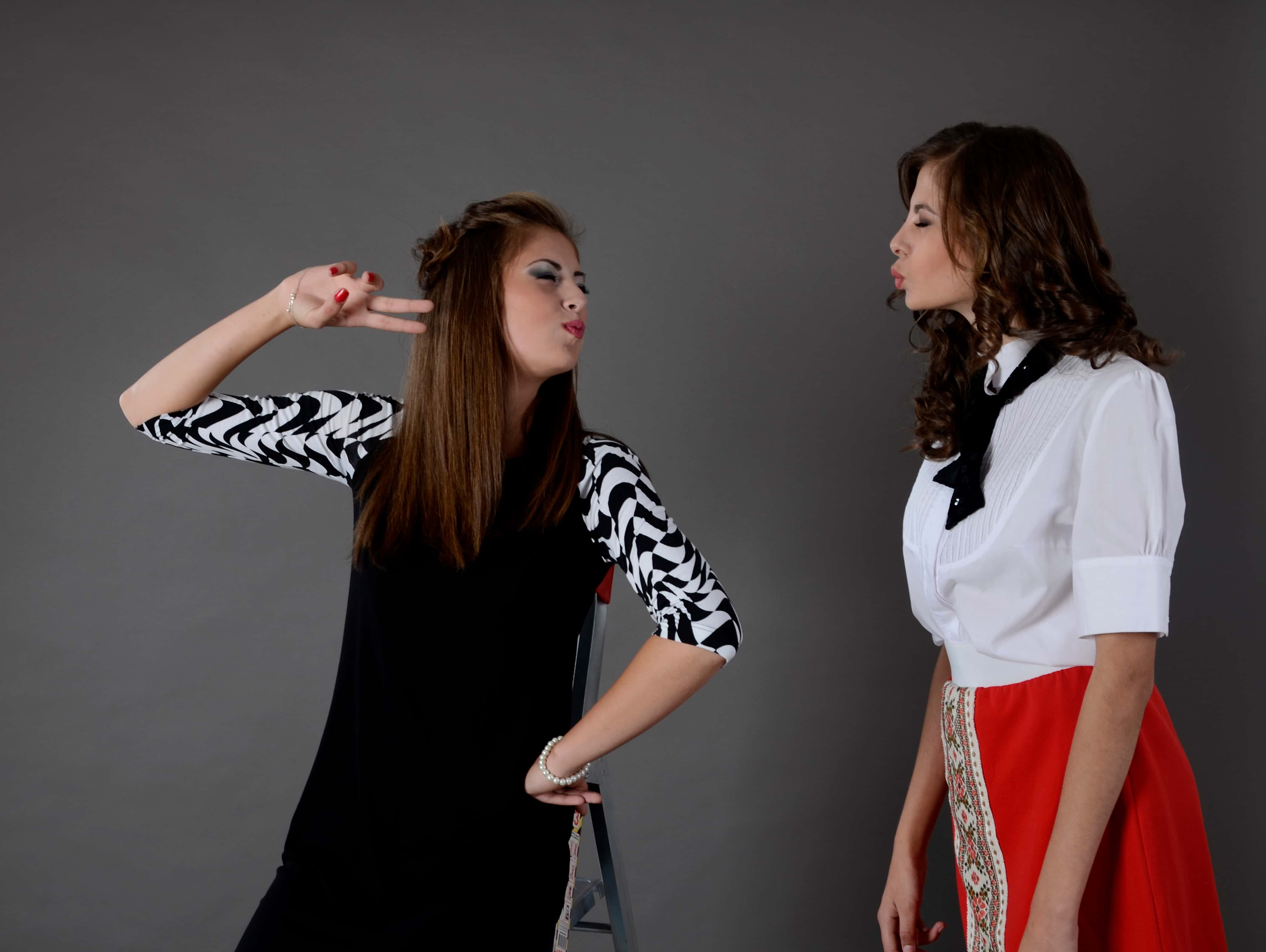 Canva - Two Woman Facing Each Other