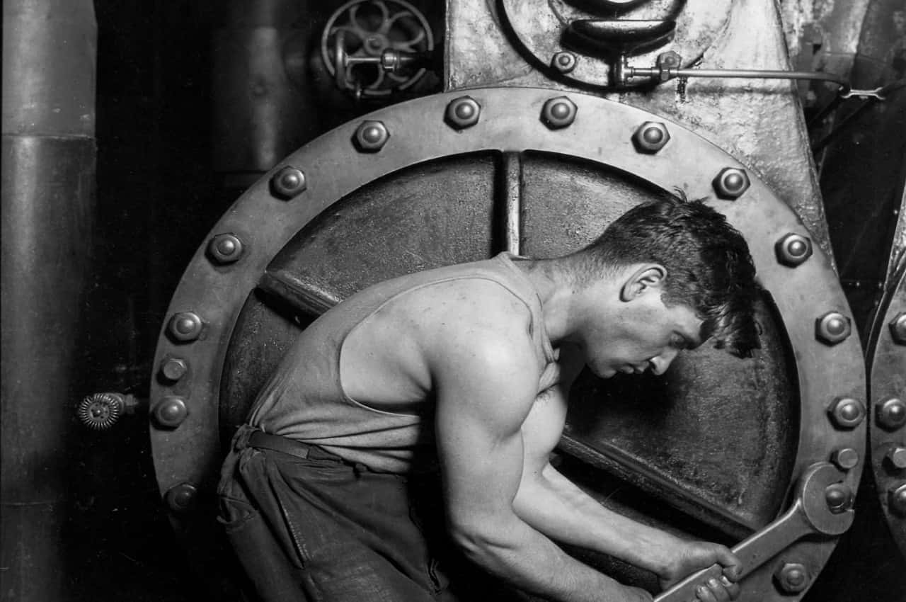 Lewis_Hine_Power_house_mechanic_working_on_steam_pump