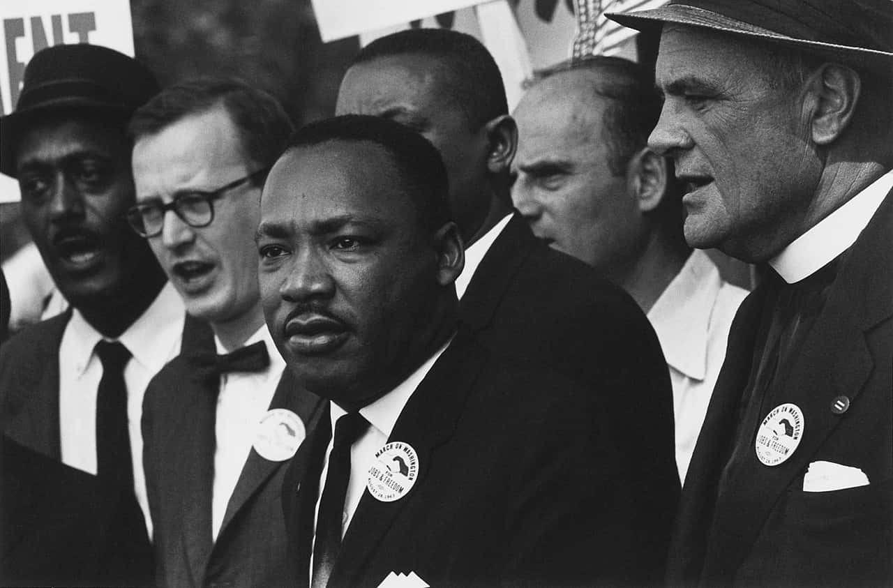 1280px-Civil_Rights_March_on_Washington,_D.C._(Dr._Martin_Luther_King,_Jr._and_Mathew_Ahmann_in_a_crowd.)_-_NARA_-_542015_-_Restoration