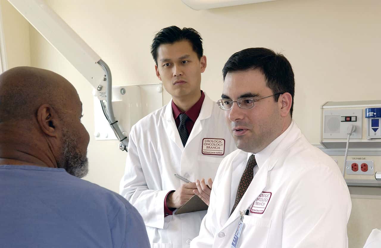 1280px-Doctor_consults_with_patient_(4)