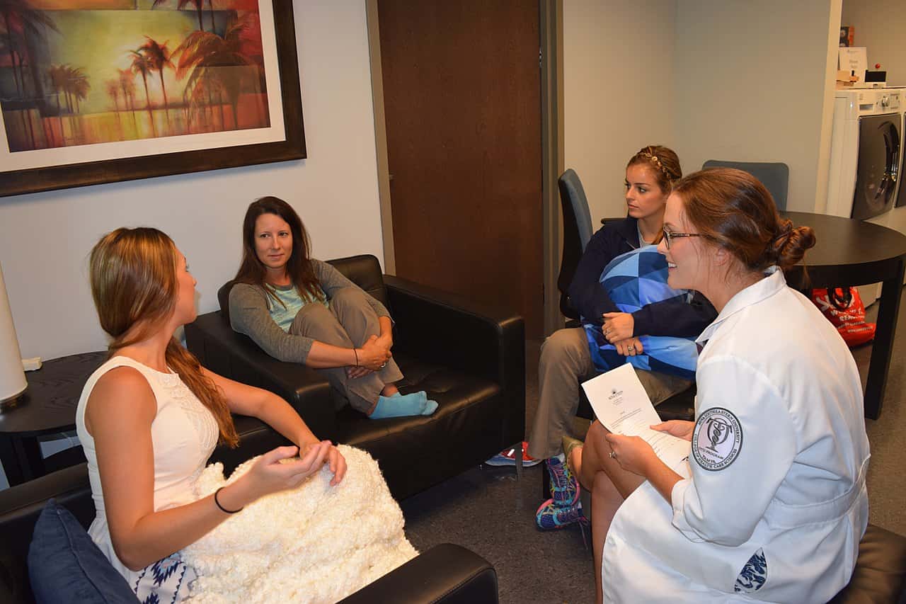 1280px-Occupational_therapist_conducting_a_group_intervention_on_interpersonal_relationship_building