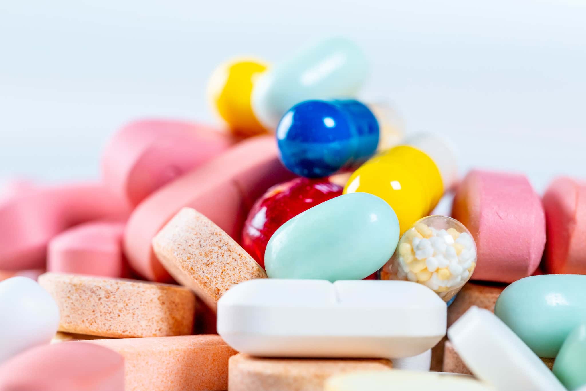 Close - up of many different pills and capsules