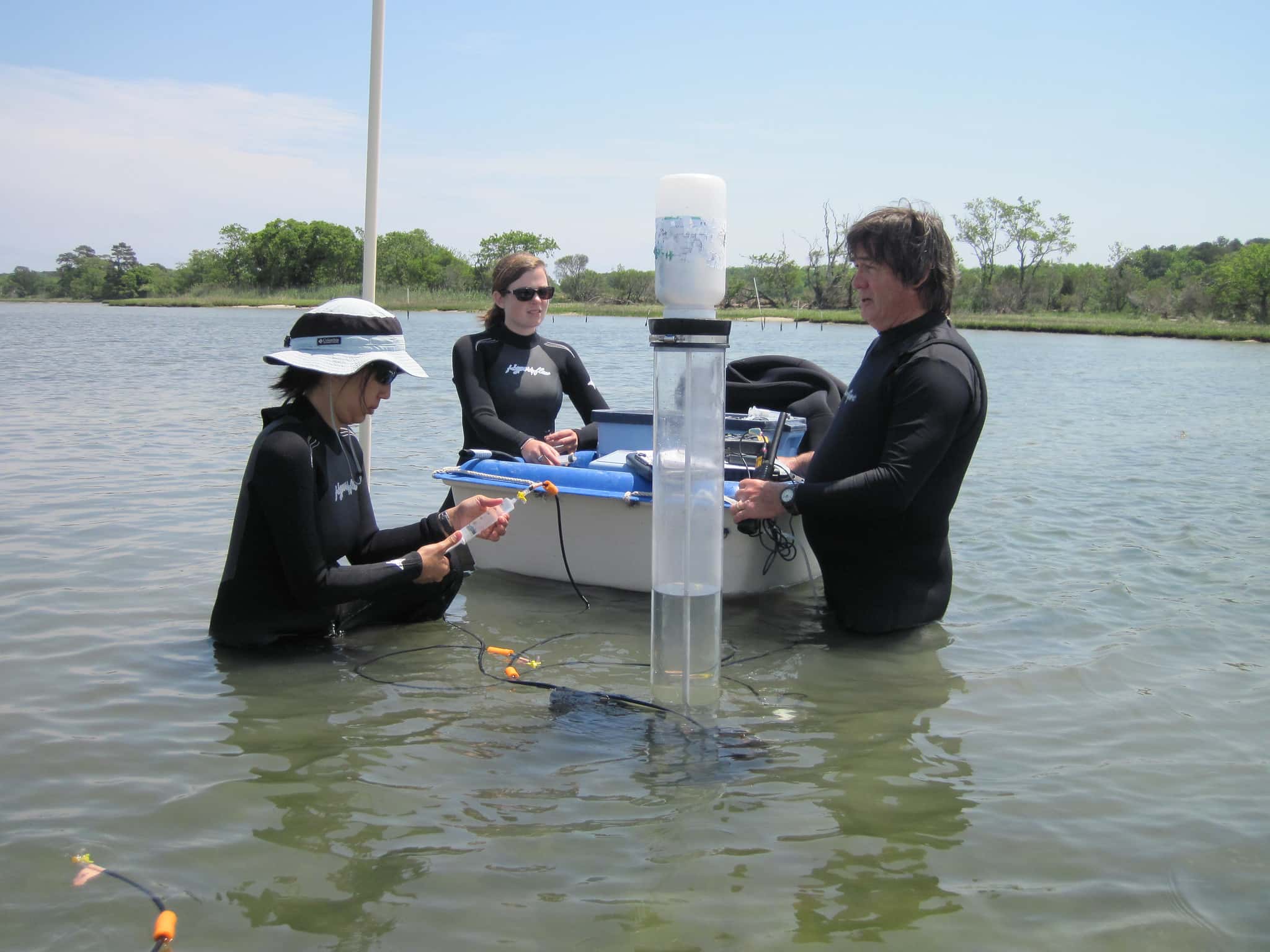 Marine Scientist Jennifer Stanhope, VASG Graduate Research Fellow Annie Murphy, and Mark Luckenbach take water samples from the cores over the course of the day to measure the nutrient concentrations in the water. ©Margaret Pizer/VASG
