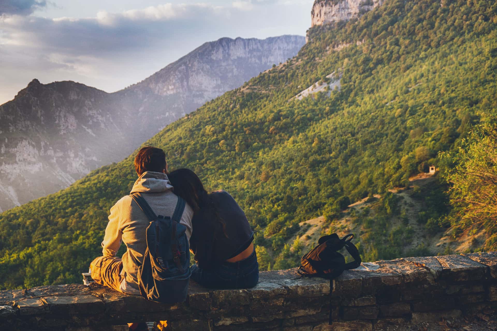 Canva - Couples Sitting in While Facing Mountain(1)