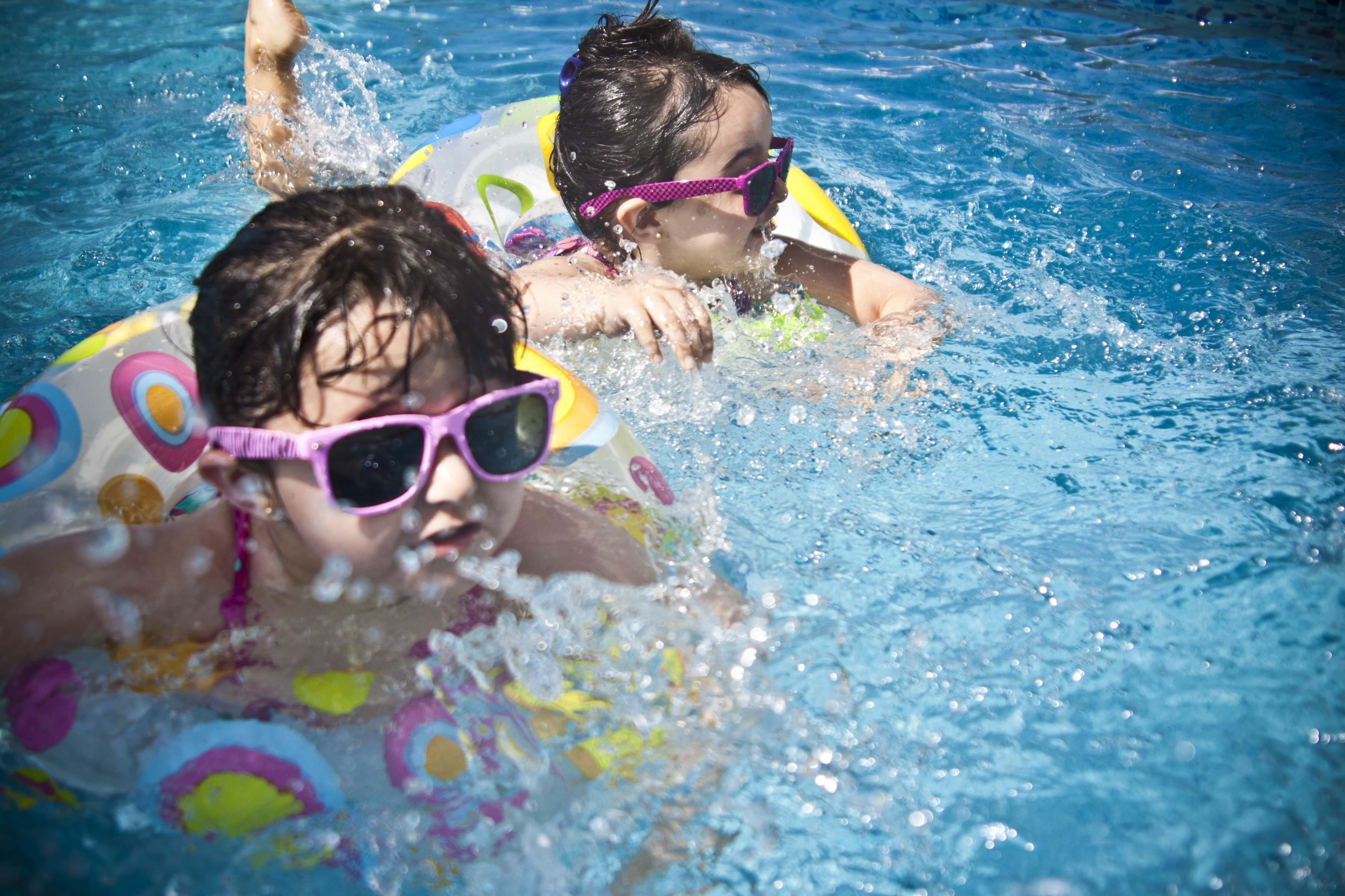 Canva - Cute Kids Swimming in the Pool