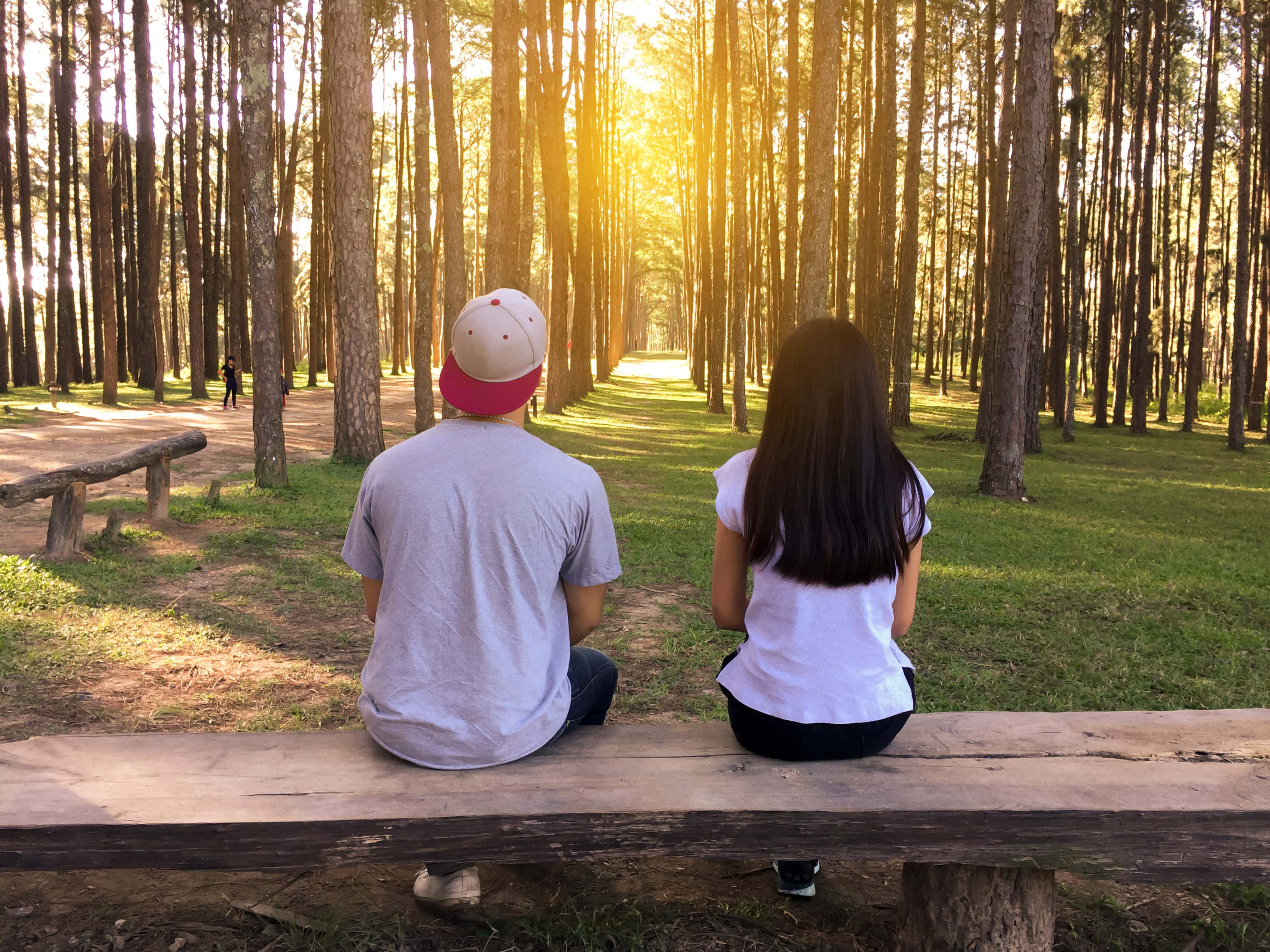 Happy couple embracing at sunset in the nature