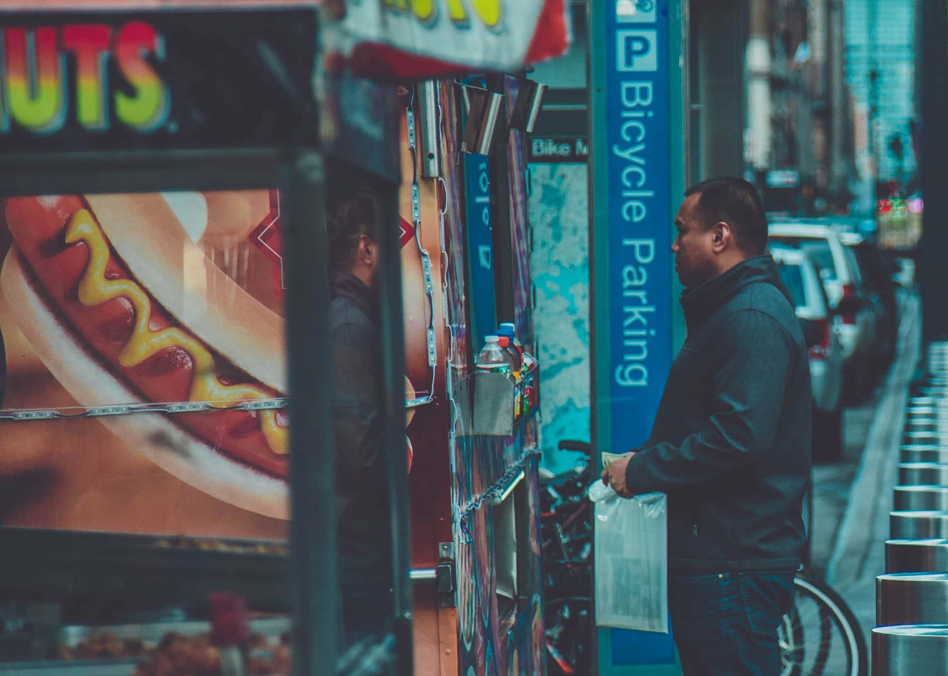 Canva - Man Standing in Front of Food Stall(1)