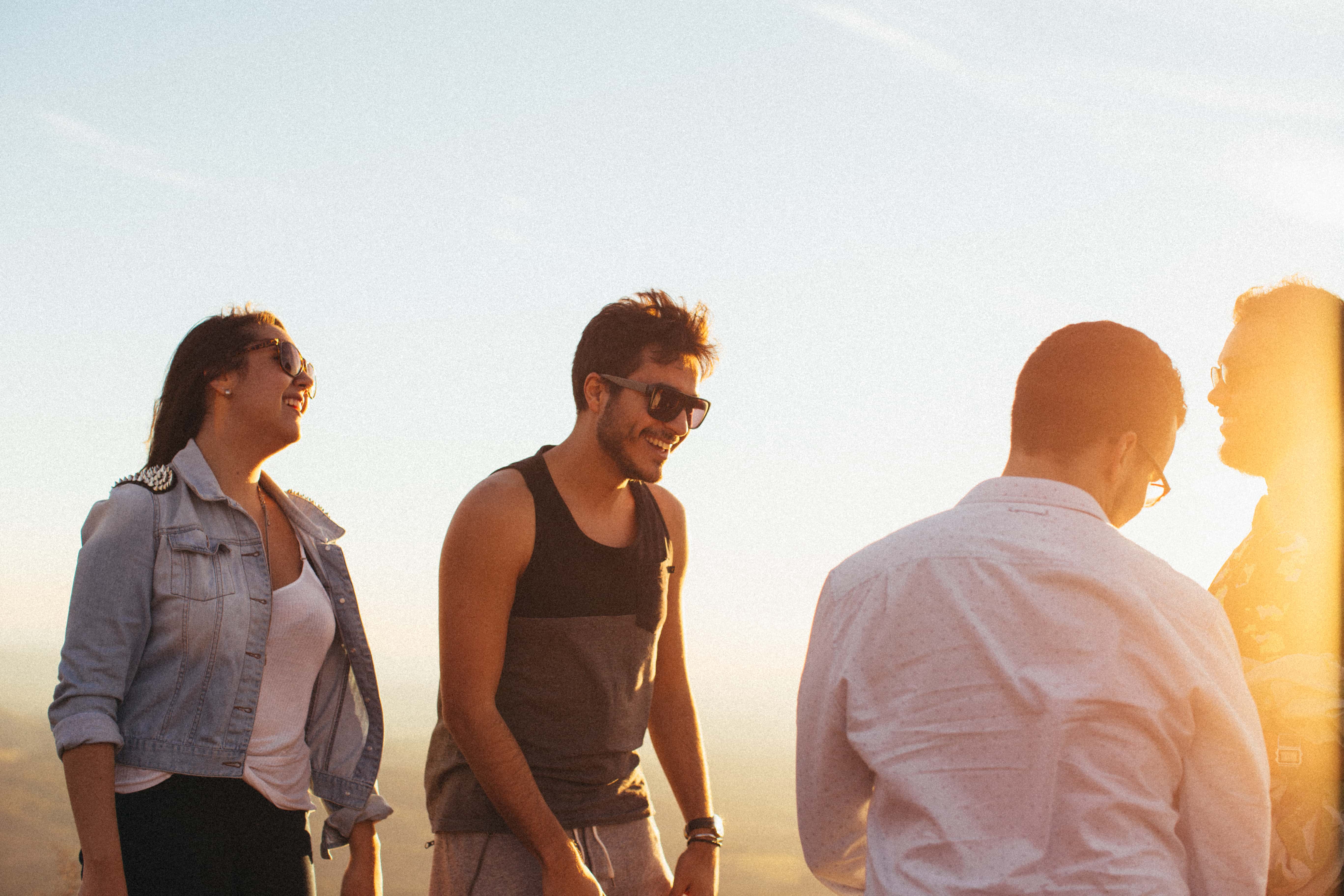 Canva - Man Wearing Black Tank Top Standing Beside Woman Wearing Blue Denim Jacket