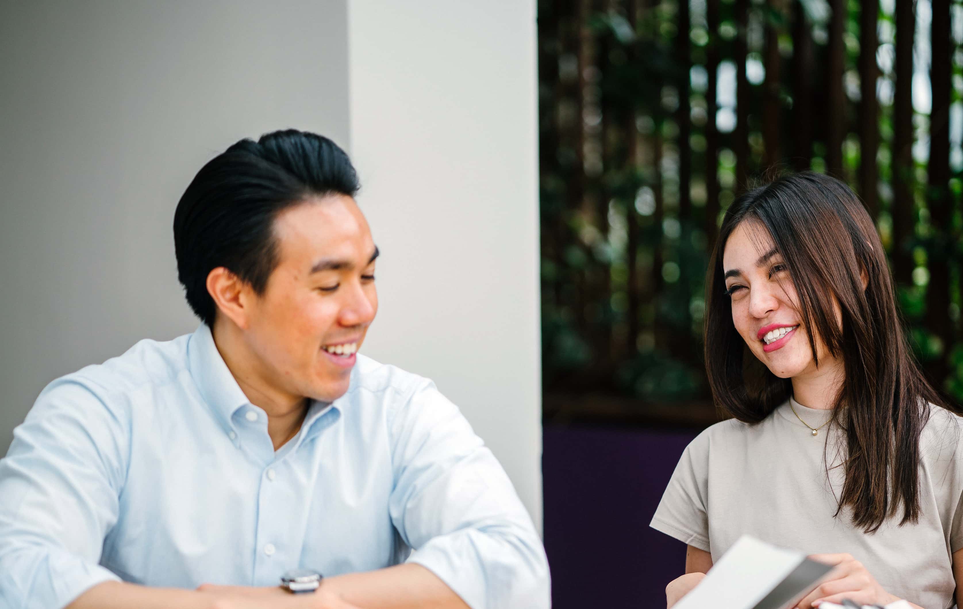 Canva - Man and Woman Sitting on Chair in Front of Desk