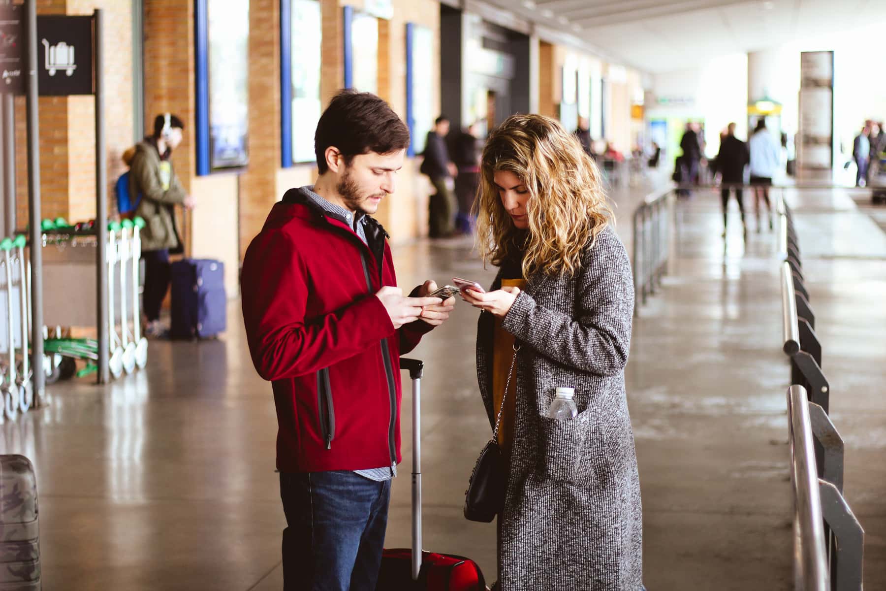 Canva - Photo of Man and Woman Using Their Phones