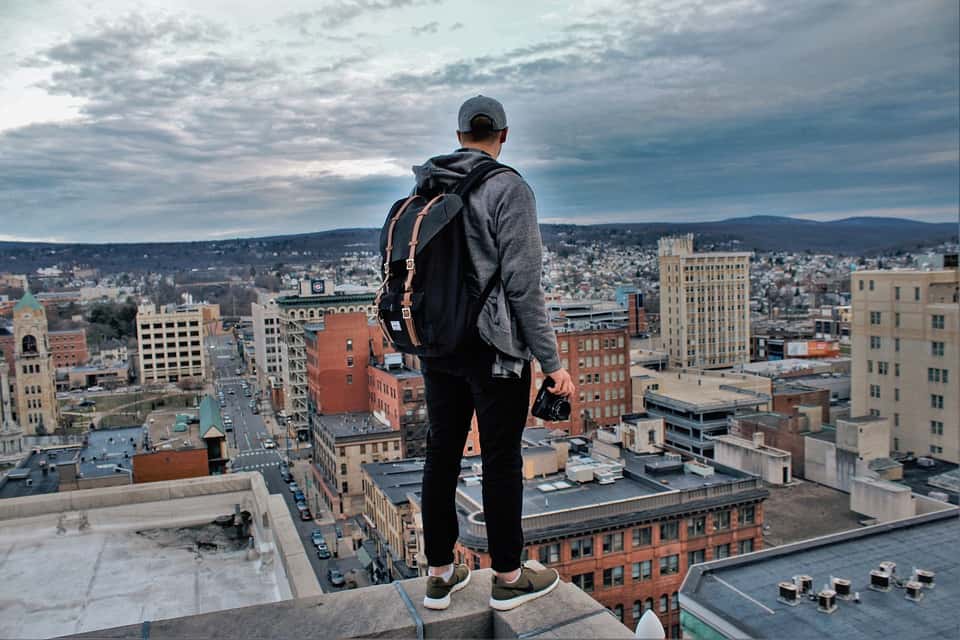 City Man Buildings Edge Rooftop People Herschel