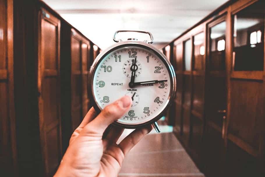 clock-corridor-wooden-door