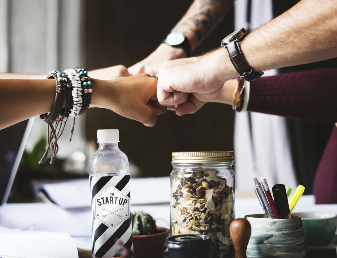 closeup-colleagues-cooperation-desk-fist-fist-bump-1451617-pxhere.com