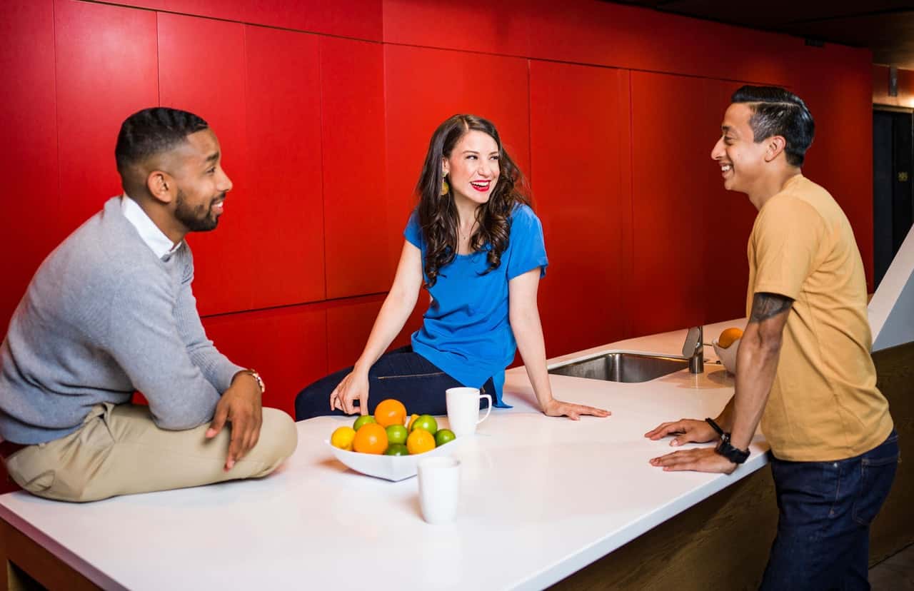 three-people-near-table-talking-2422284