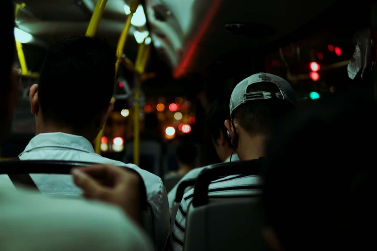 two-men-sitting-inside-bus-during-night-time-1567766