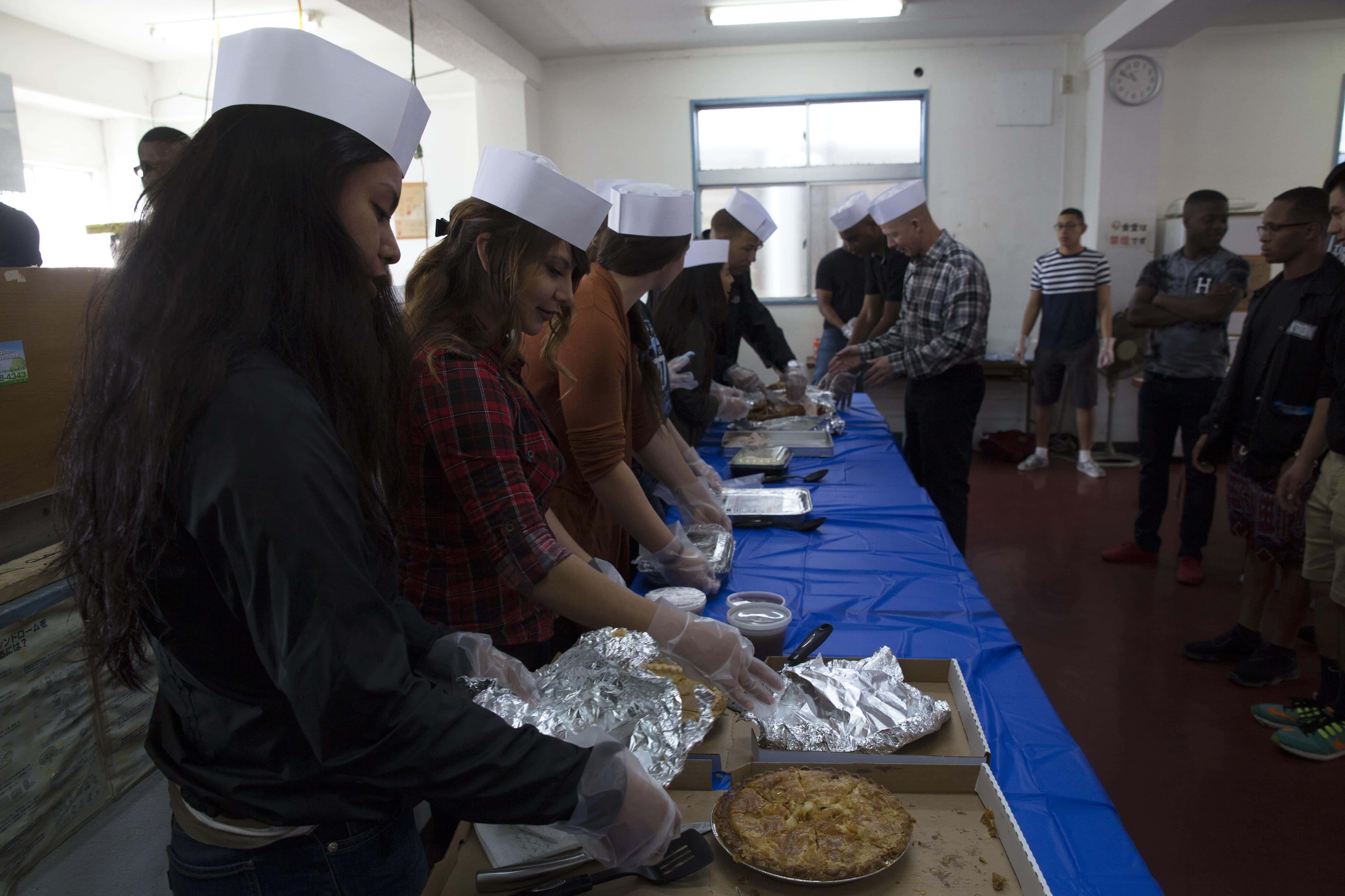 Camp Kinser service members serve Thanksgiving meal at Okinawa homeless shelter