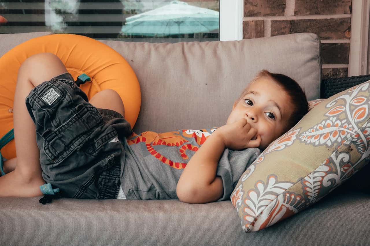 photo-of-boy-lying-on-sofa-2406954