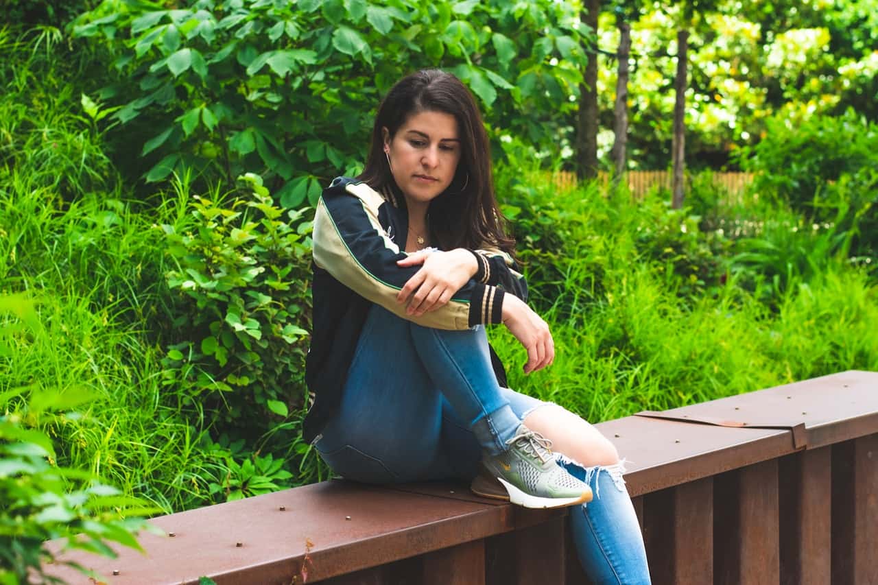 photo-of-woman-sitting-alone-brown-bench-thinking-2492015