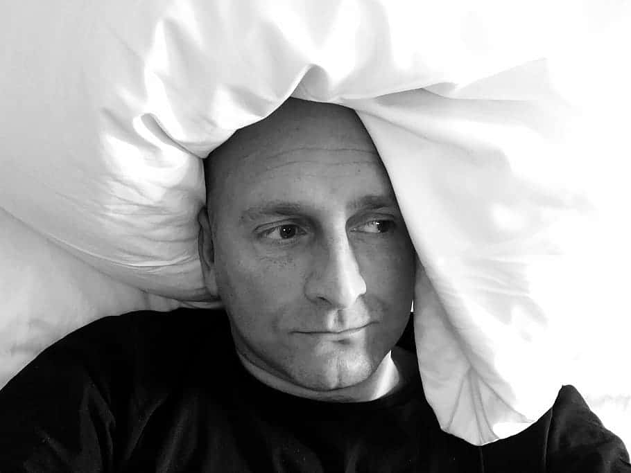 portrait-reflective-male-in-bed