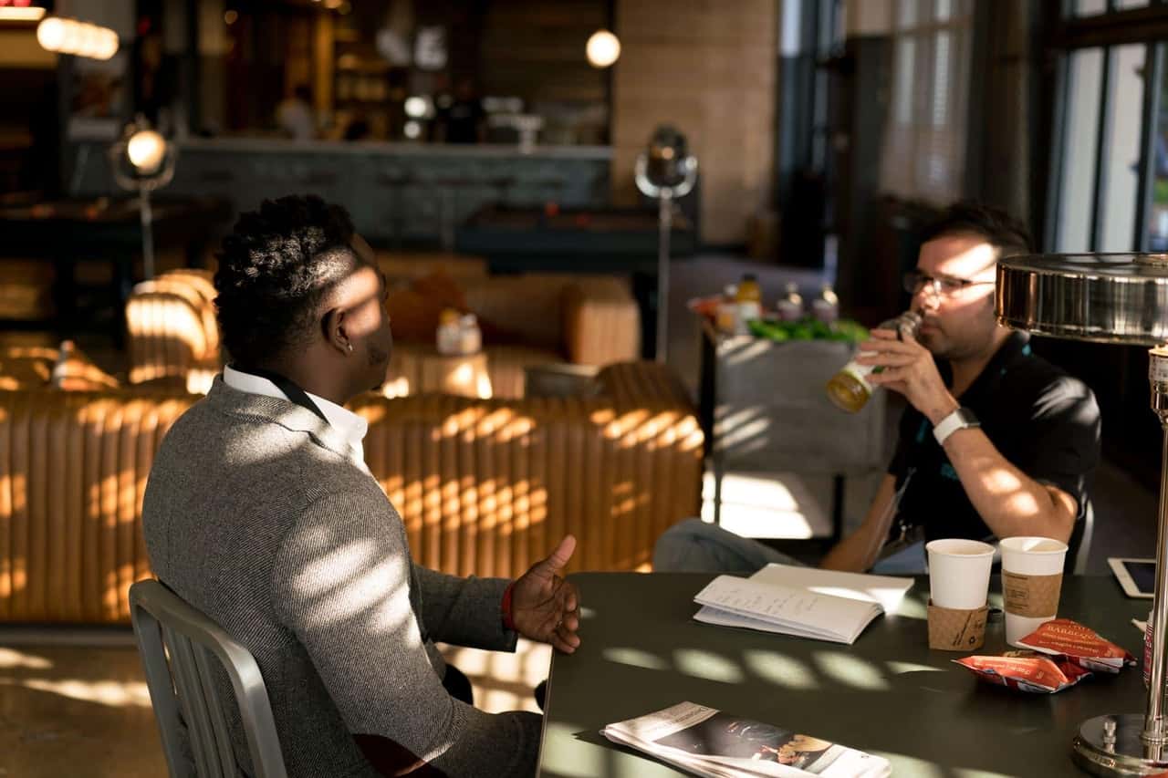 two-men-in-a-conversation-936095