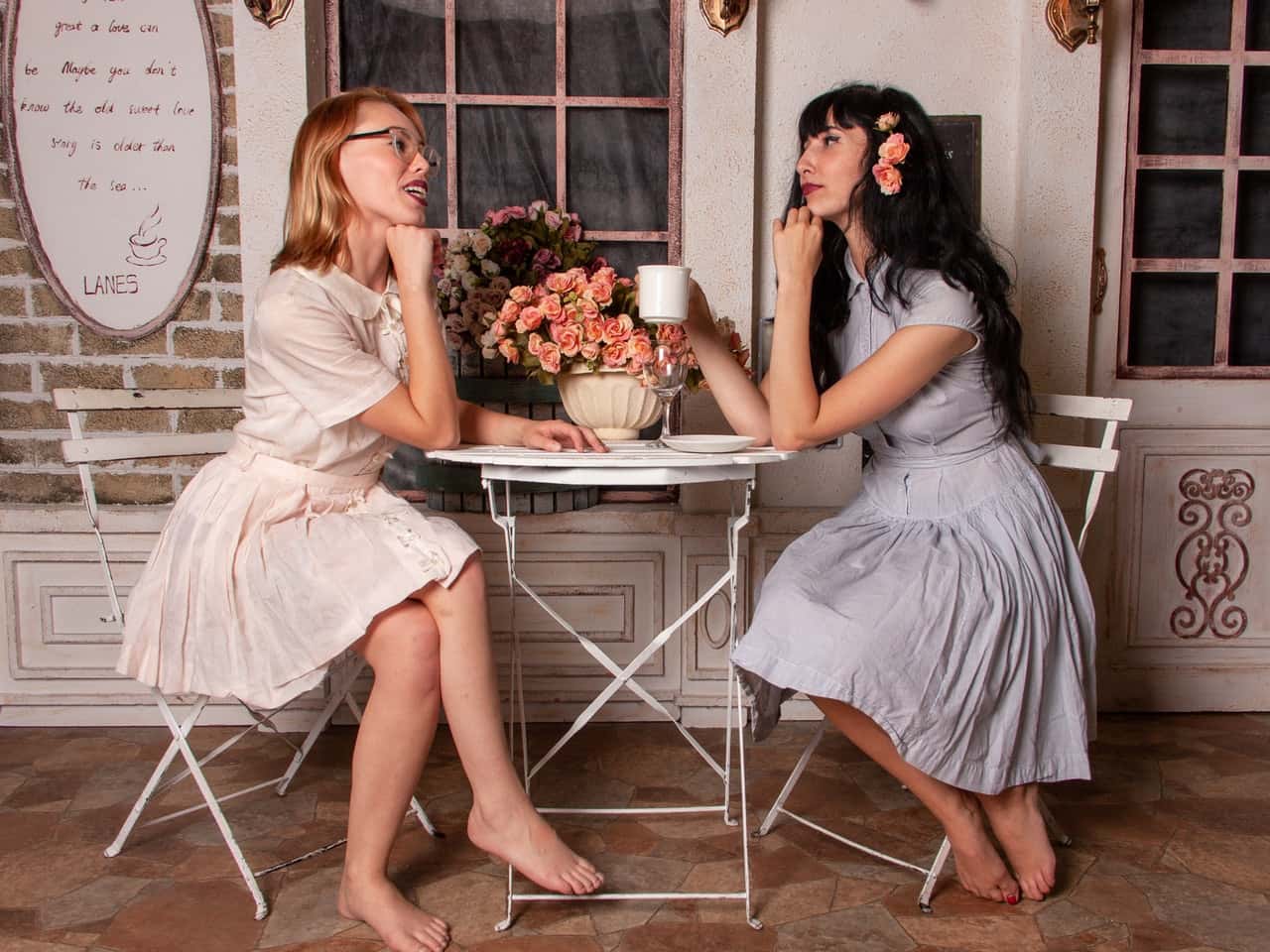 two-women-talking-while-drinking-coffee-1644911