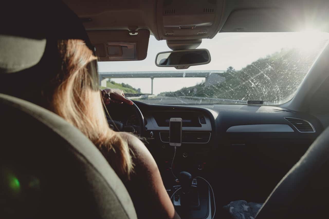 woman-driving-car-on-freeway-1386648