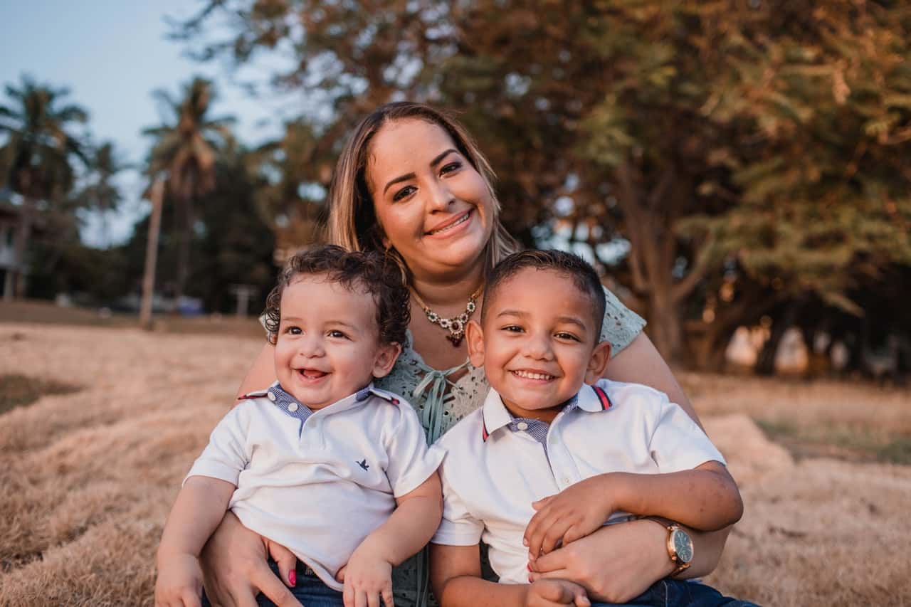 woman-holding-two-boys-1470110