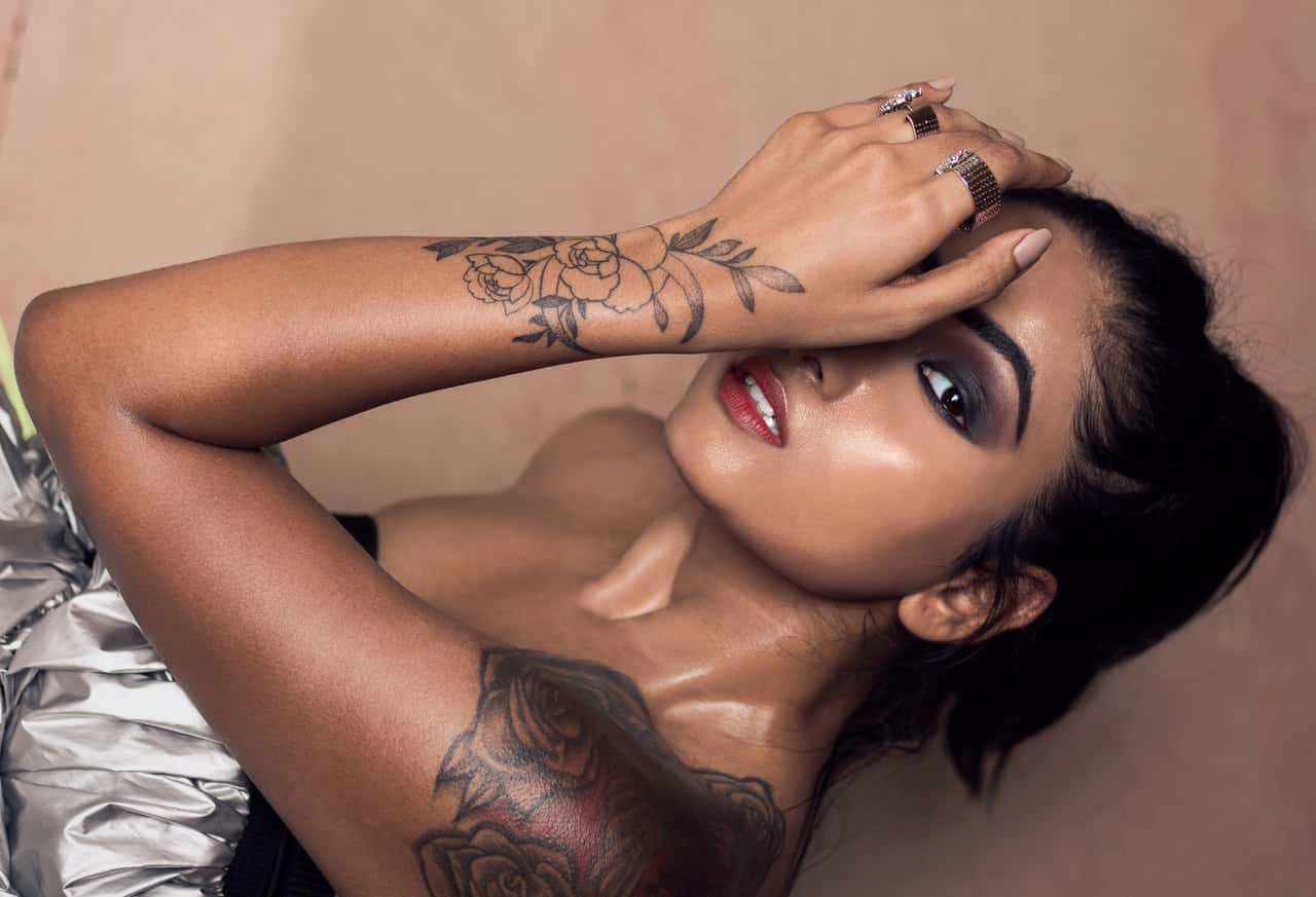 woman-showing-tattoo-on-hand-and-shoulder-2768618