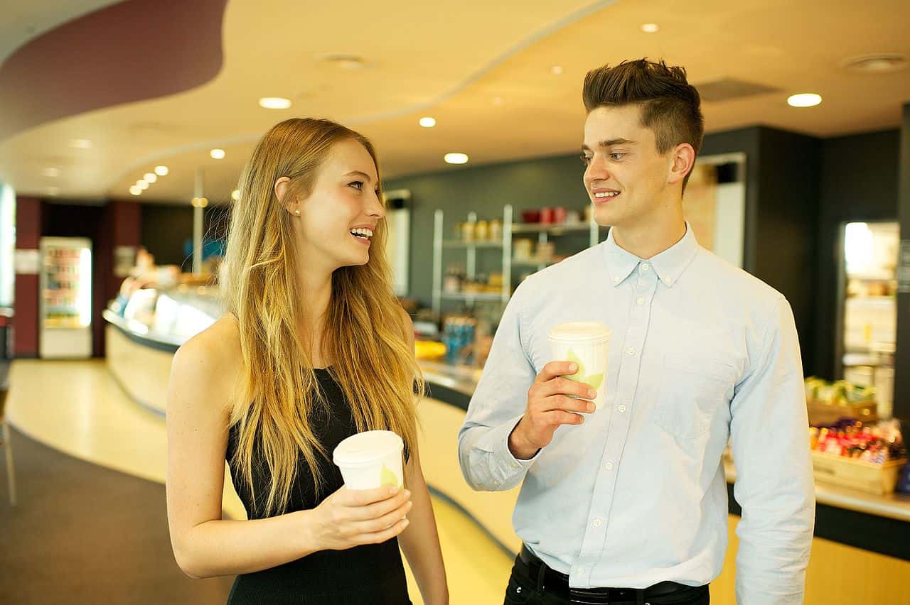 CSIRO_ScienceImage_2241_A_man_and_woman_chatting_outside_a_cafe