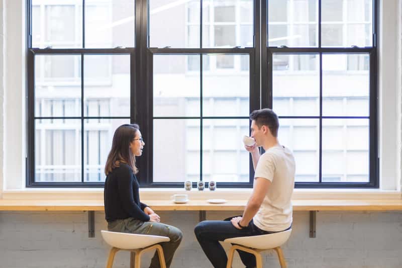 Canva - Couple Drinking Coffee Outdoors